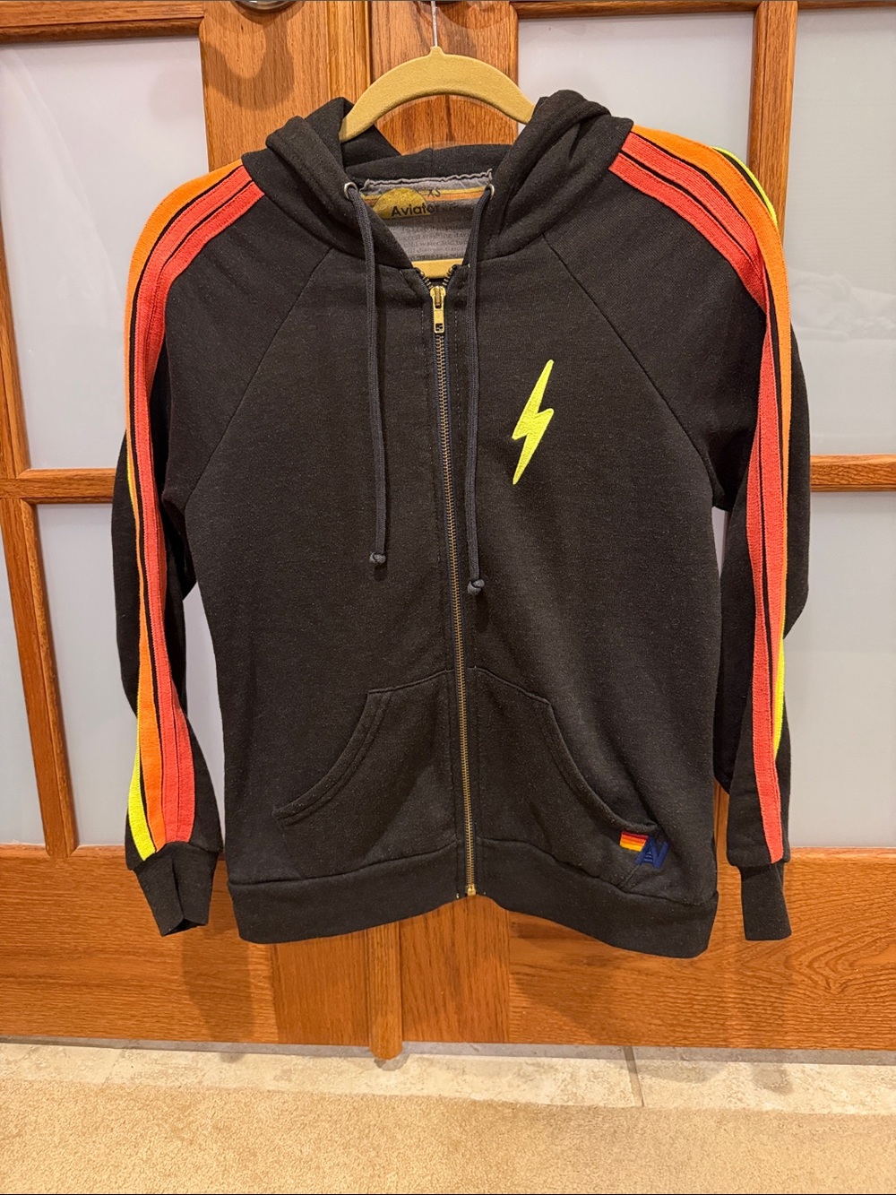Aviator Nation Black Zip Hoodie with Red, Orange & Yellow Sleeve Stripes